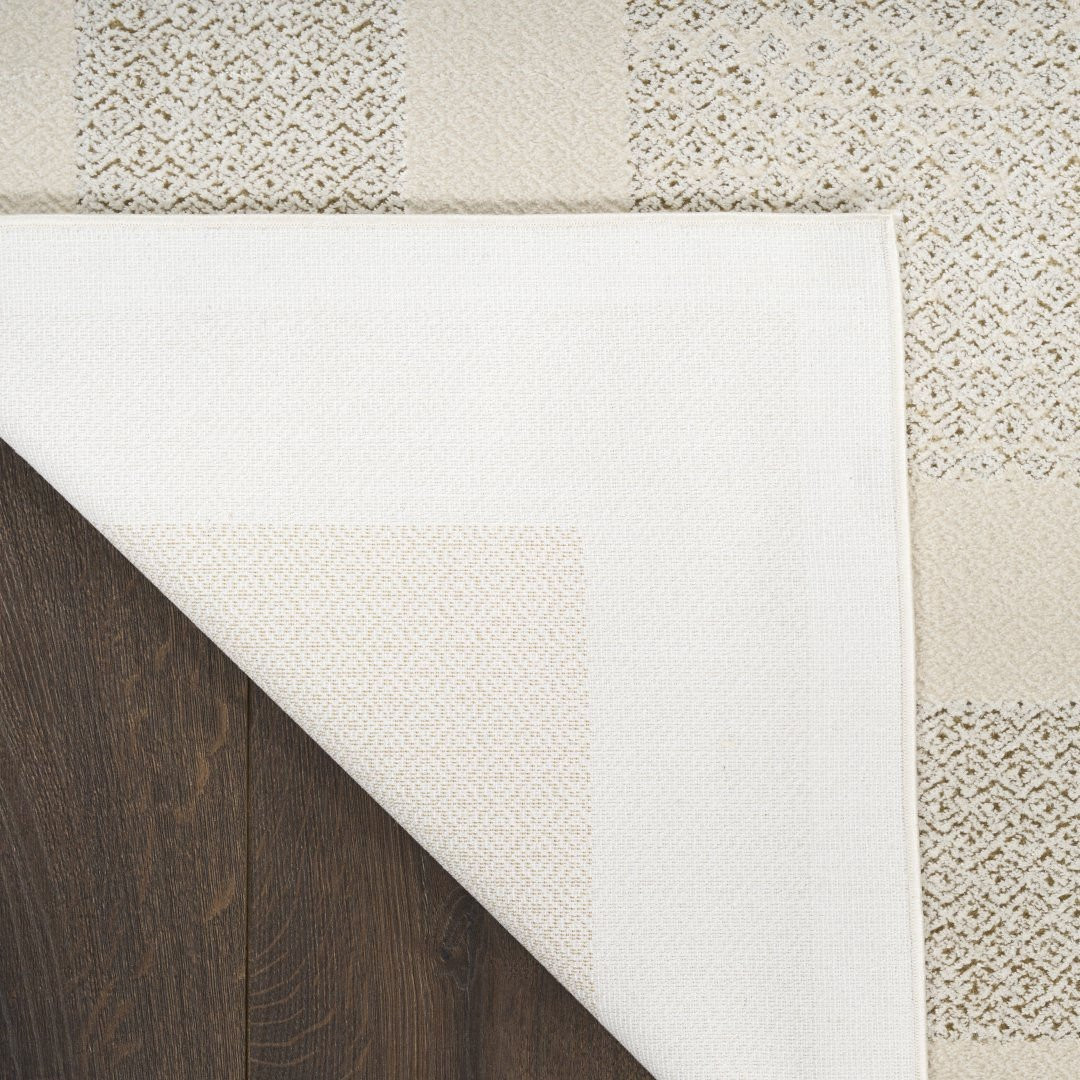 Koberec DKNY Grand Street sloní kost / světle hnědý