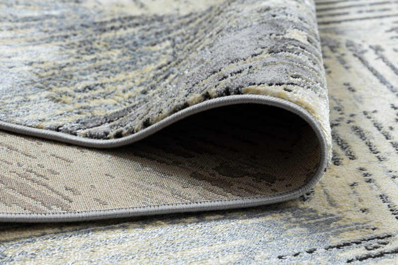 Koberec DE LUXE 2087 Jodelka Chevron vintage - zlatý / šedý