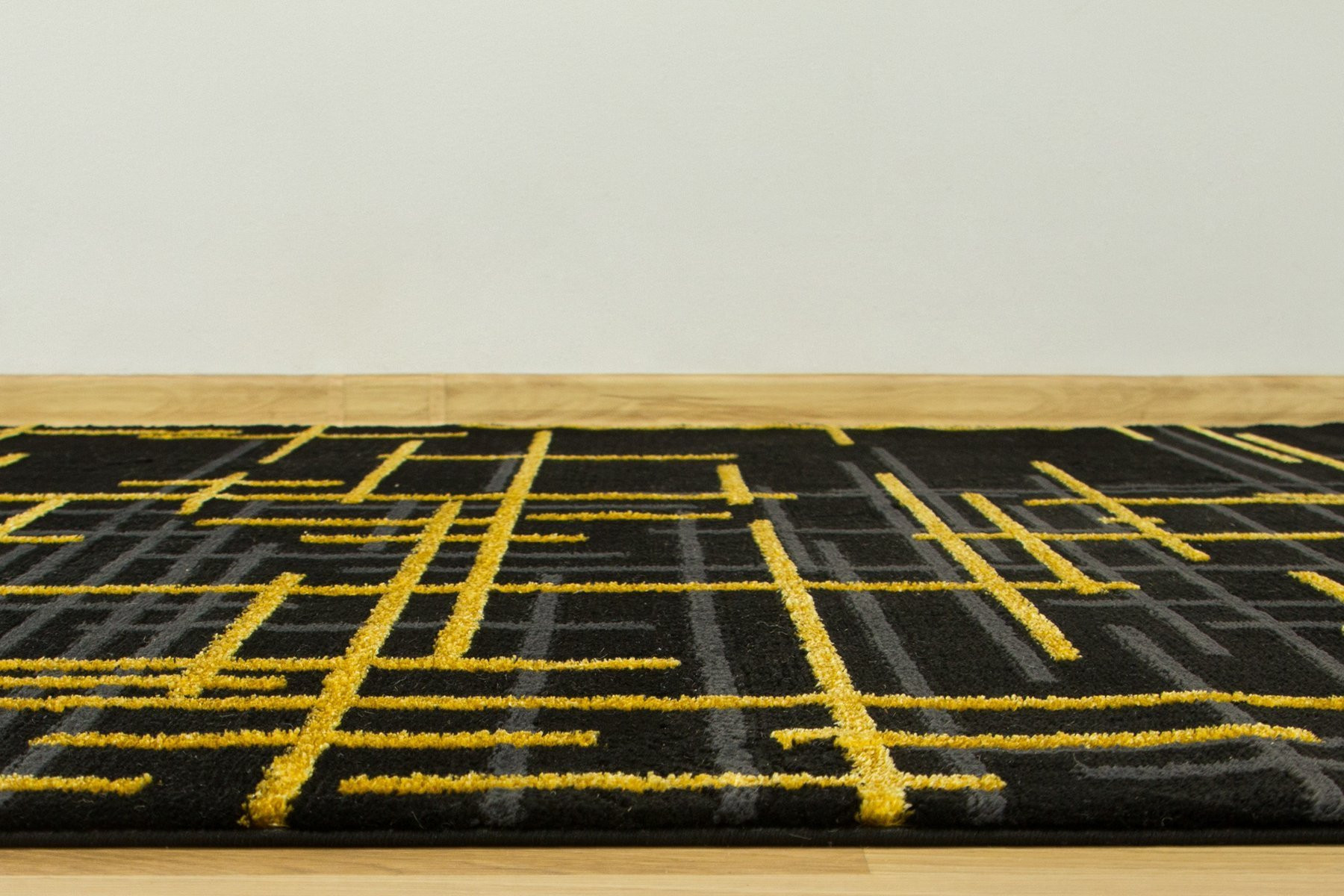 Koberec FESTIVAL 2732A zlatý / černý